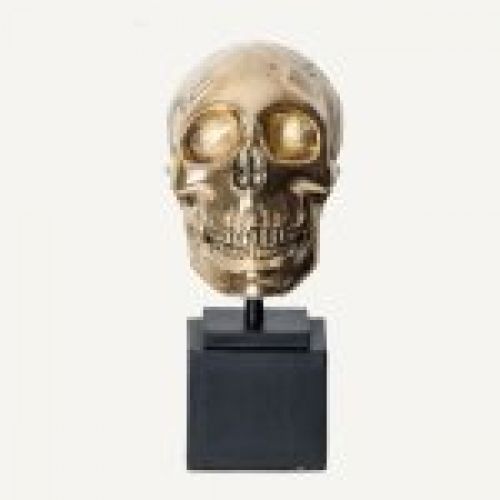 Busto dorado con forma de calavera